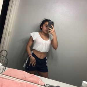 A white crop top with a pretty design